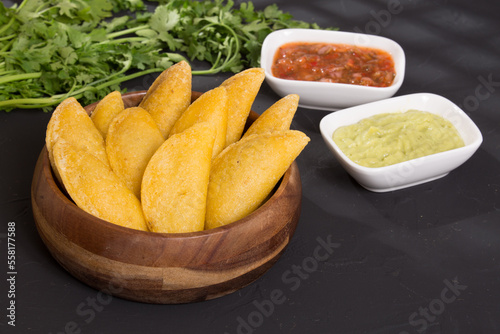 Colombian empanada - on the black background.traditional colombian food
