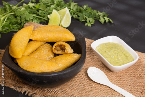 Colombian empanada - on the black background.traditional colombian food