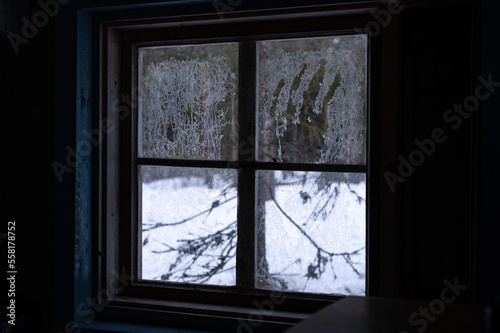 Spooky handprint on a window in an old  isolated cabin in the woods. Finland