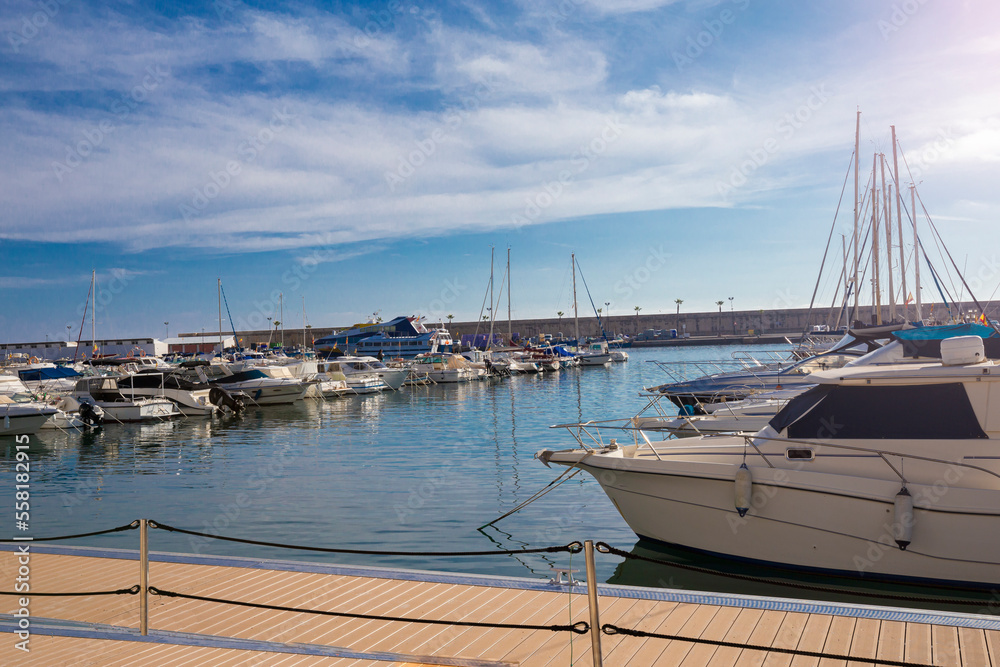 Fototapeta premium Mediterranean sea coast in the resort town overlooking the promenade and harbor with yachts, province of Alicante,Villa Hoyosa, Costa Blanca, Spain
