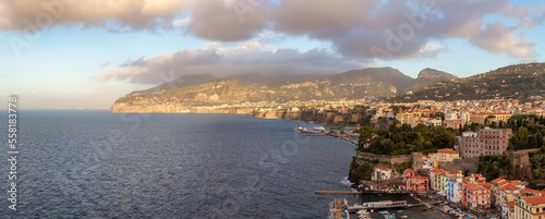 Fototapeta Naklejka Na Ścianę i Meble -  Rocky Coast and Homes in Touristic Town, Sorrento, Italy. Amalfi Coast. Aerial Panorama