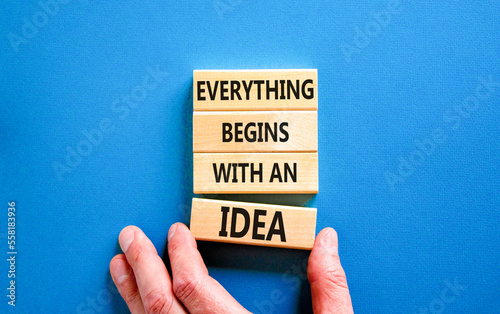 Everything begins with an idea symbol. Concept word Everything begins with an idea on wooden blocks. Beautiful blue table blue background. Business everything begins with an idea concept. Copy space.