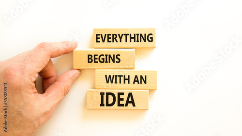 Everything begins with an idea symbol. Concept word Everything begins with an idea on wooden blocks. Beautiful white table white background. Business everything begins with an idea concept. Copy space