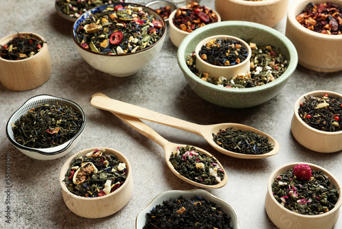 Many different herbal teas on grey table