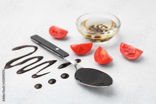 Organic balsamic vinegar and cooking ingredients on white table
