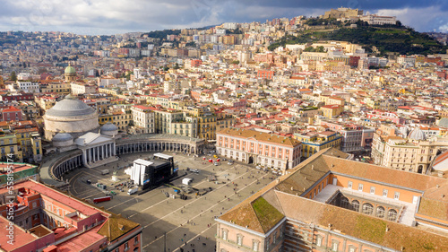 Aerial view of Piazza del Plebiscito, a large public square in the historic center of Naples, Italy. It's bounded by San Francesco di Paola' s church. In background Castel Sant' Elmo and Vomero hill. photo