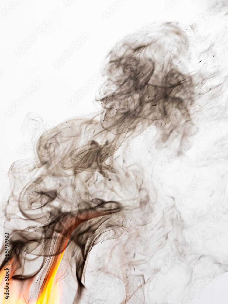 Fire and brown smoke on a light background
