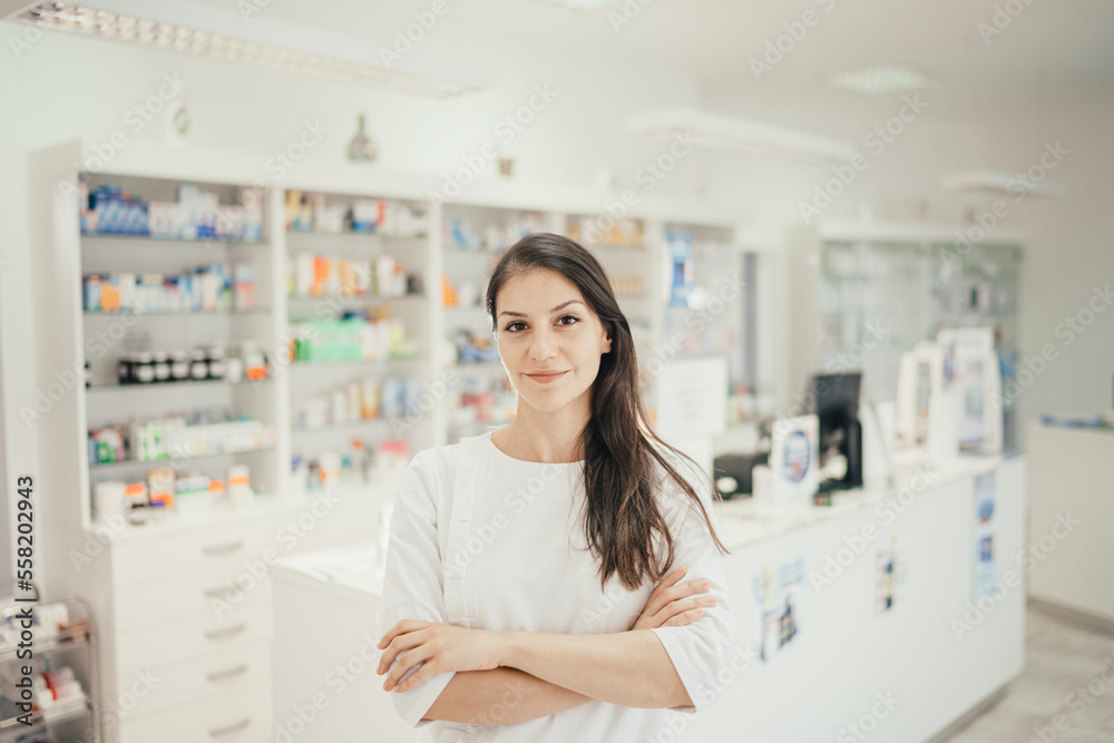 Health care professional woman working at a pharmacy drugstore.Friendly pharmacist ready to give advice. Medication and therapy expertise. Pharmaceutical service.Prescription drug administration