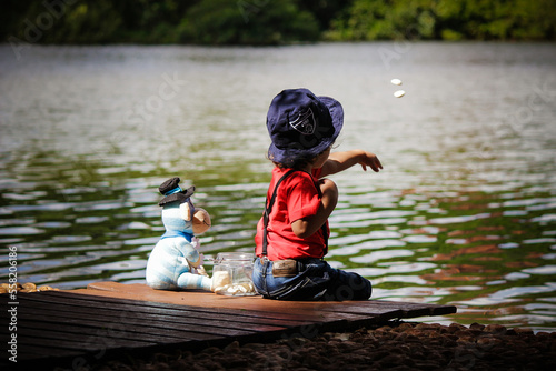 child playing in the lake