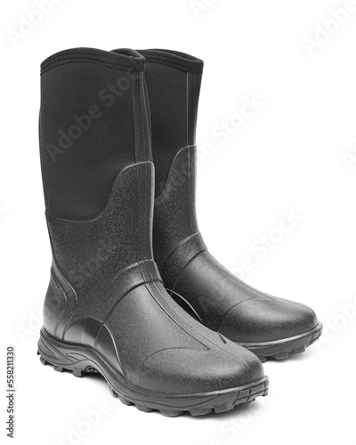 A pair of insulated rubber boots on white