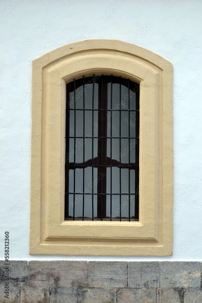 The beautiful exterior facade with a wooden door in the historic of Cordoba Spain