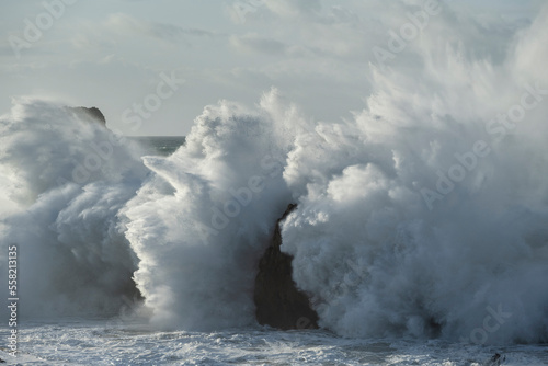 Large winter waves crash at Playa de la Arnia, Cantabria, Spain