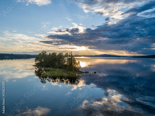 Aerial View Small Island in the Sandsj  n Lake in Sandsj  n  s  Swedish Lappland during Sunset with reflections in the water