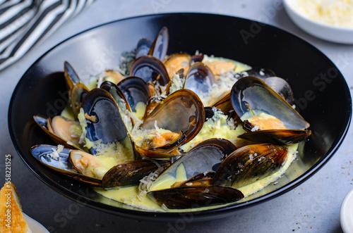 Freshly cooked mussles in wine and creamy sauce in a plate