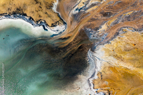Aerial view of the famous red mud disaster site, abstract lines, surreal landscape, icelandic feeling.