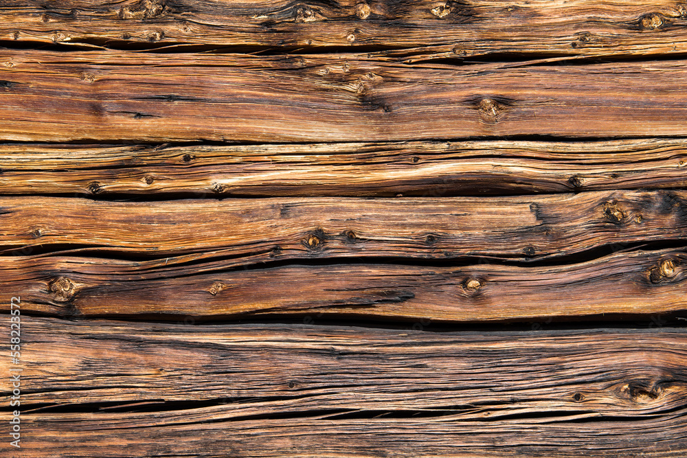 Brown wood pattern. Part of a rustic mountain hut exterior wall. Brown wood pattern. Part of a rustic mountain hut exterior wall.