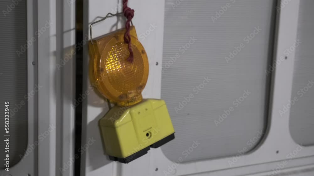 Blinking and flashing yellow warning light near construction zones at