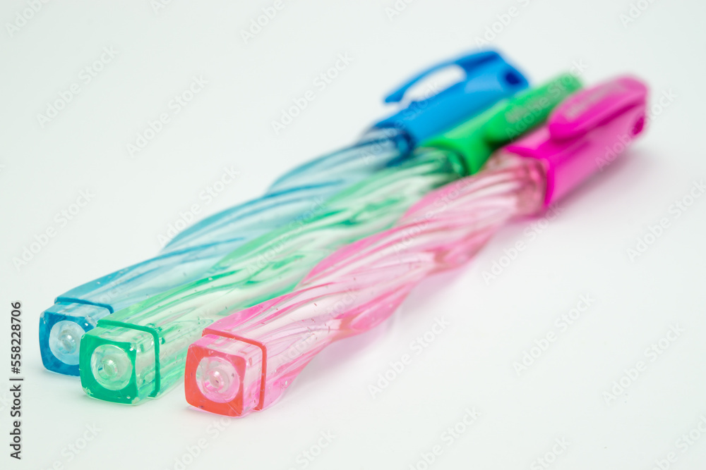 three color pens on white background three color pens on white background