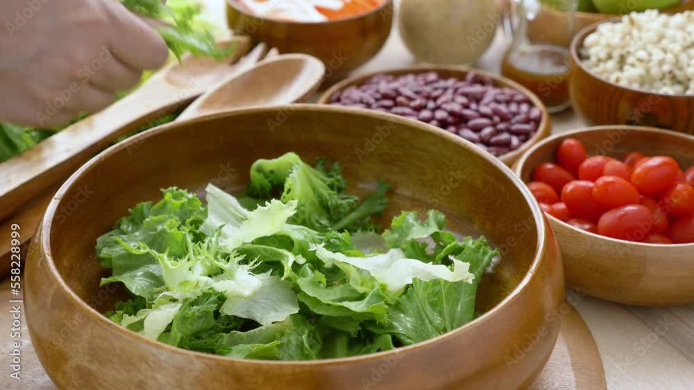 Mix Green Salad by Hand chef , Millet,Crab Stick In glass bowl. Breakfast fresh salad and clean vegetable can eat raw. Salad mix leaves green vegetable Mix Green Salad by Hand chef , Millet,Crab Stick In glass bowl. Breakfast fresh salad and clean vegetable can eat raw. Salad mix leaves green vegetable