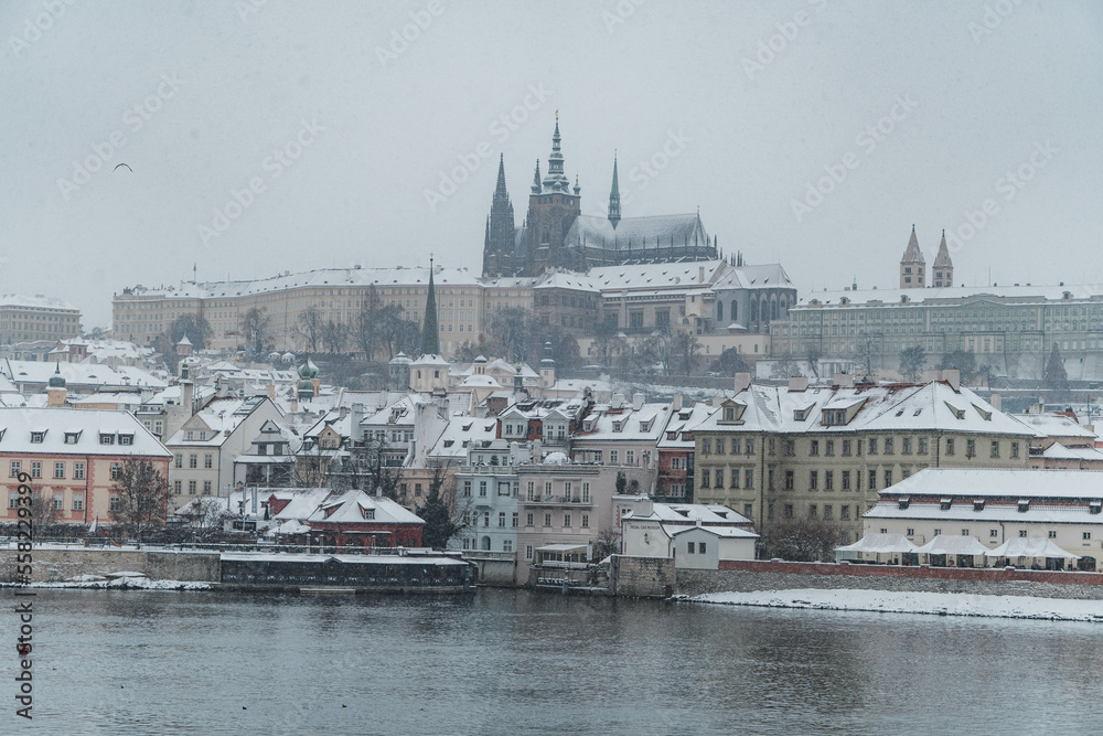 Snowy Prague. Photo of Prague Castle and St. Vitus Cathedral, Czechia