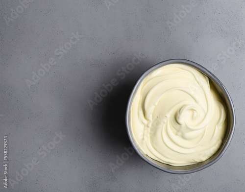 bowl of tasty mayonnaise on wooden background