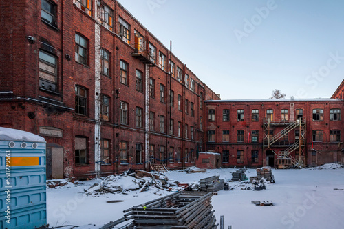 Old abandoned haunted red brick factory of stockings, pantyhose and socks in Central Europe, Poland