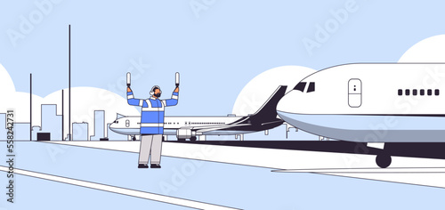 aviation marshaller supervisor near aircraft air traffic controller airline worker in signal vest professional airport staff