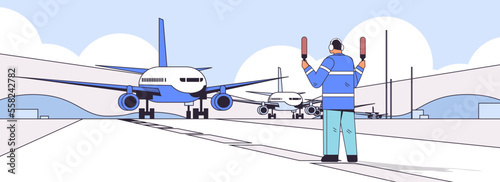 aviation marshaller supervisor near aircraft air traffic controller airline worker in signal vest professional airport staff