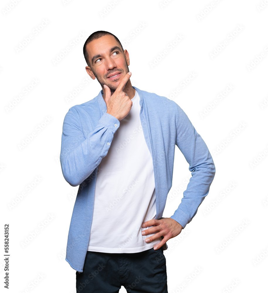 Happy young man making a gesture of doubt Happy young man making a gesture of doubt