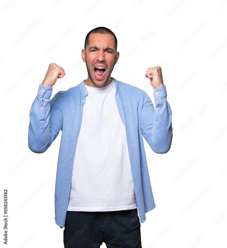 Competitive young man making a gesture of celebration