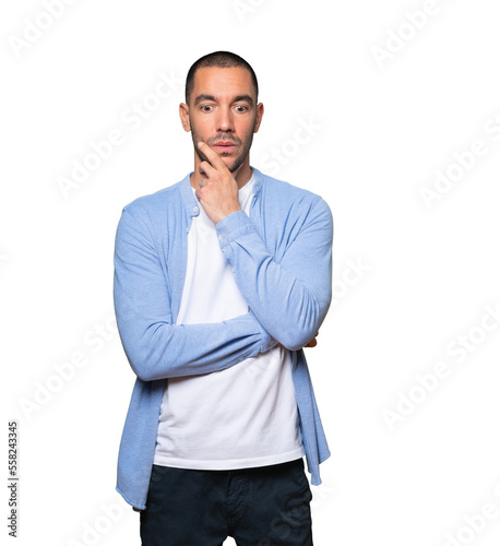 Concerned young man posing against background © agongallud
