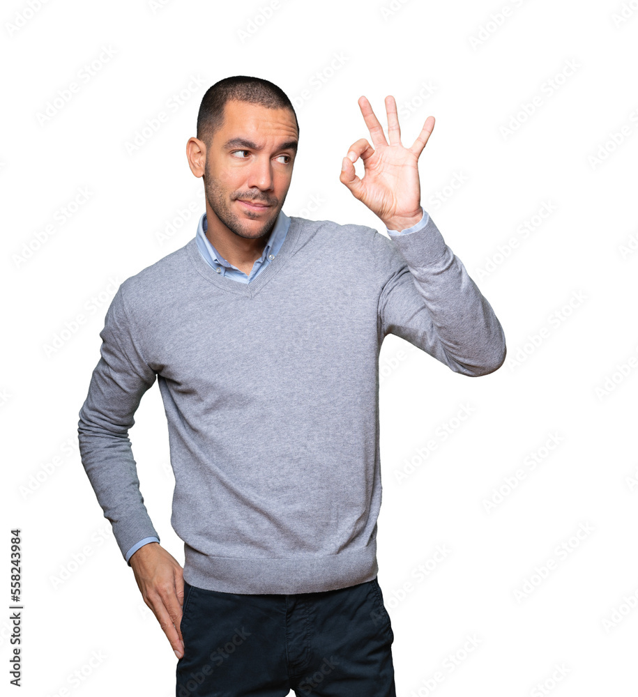 Amazed young man using his hands like a binoculars Amazed young man using his hands like a binoculars