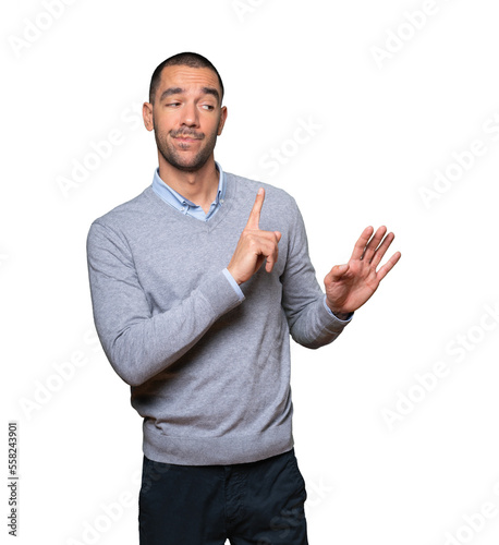 Photography Haughty young man making a contemptuous gesture