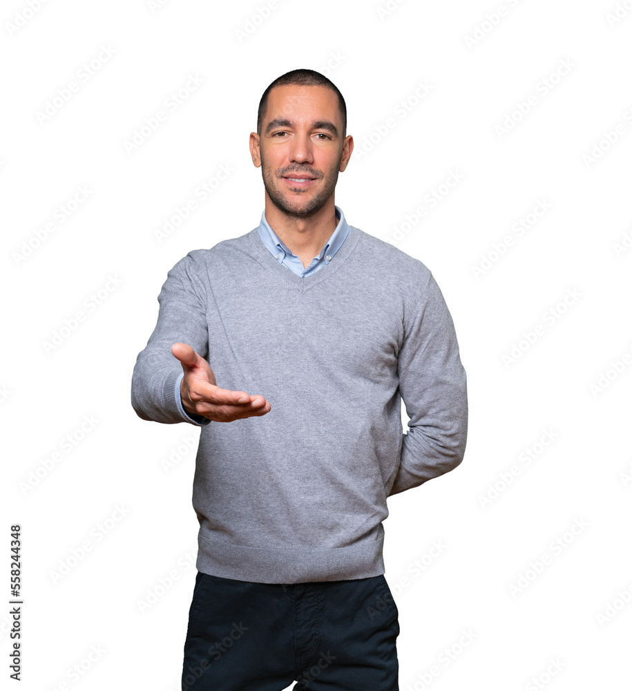 Happy young man doing a gesture of welcome with his hand Happy young man doing a gesture of welcome with his hand