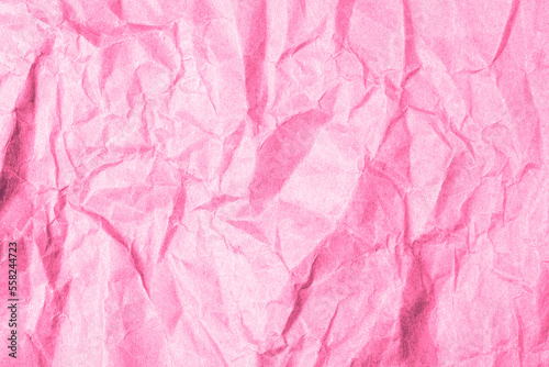 Pink crumpled paper texture, background. Space for text
