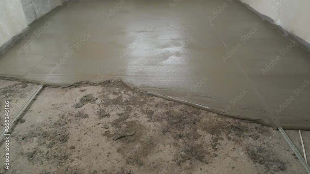 Laying paving slabs. Pointing a patio with dry grouting cement grouting mix. Seeded fine sand on