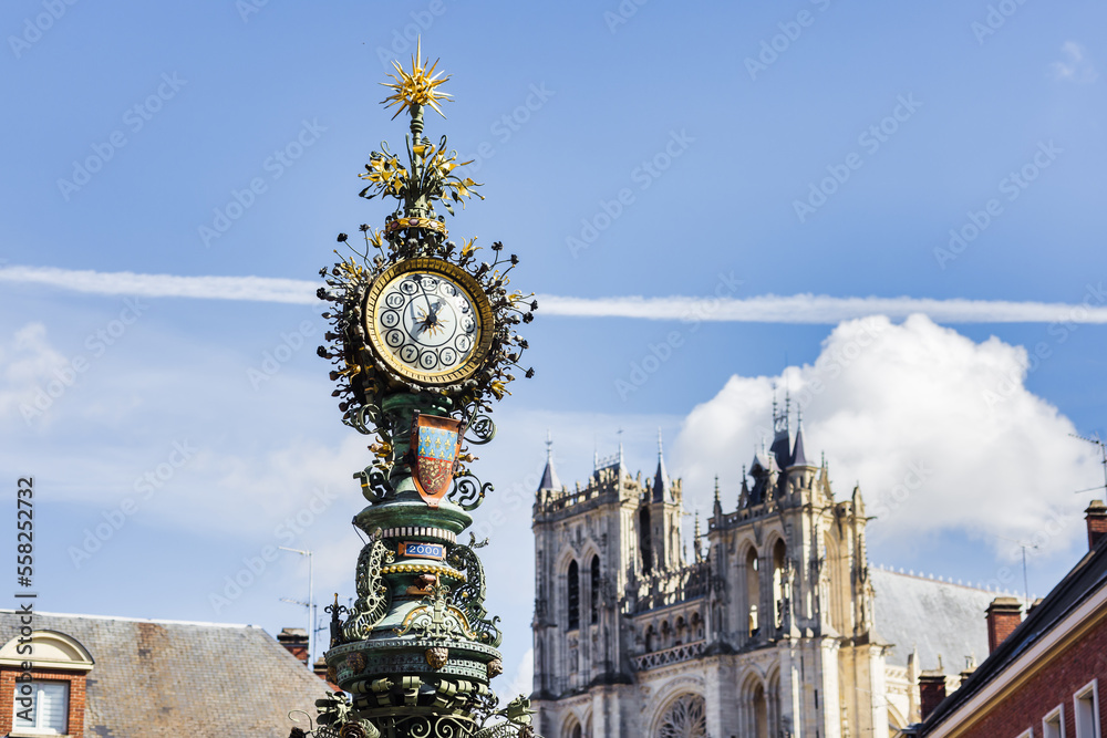 Obraz premium old street clock in front of Amiens Cathedral, Hauts-de-France, France