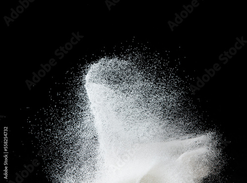 Million of white sand explosion, Photo image of falling down shower snow, heavy snows storm flying. Freeze shot on black background isolated overlay. Tiny Fine Salt sands as particle science