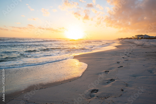 Fototapeta Naklejka Na Ścianę i Meble -  Footsteps on beach at sunset
