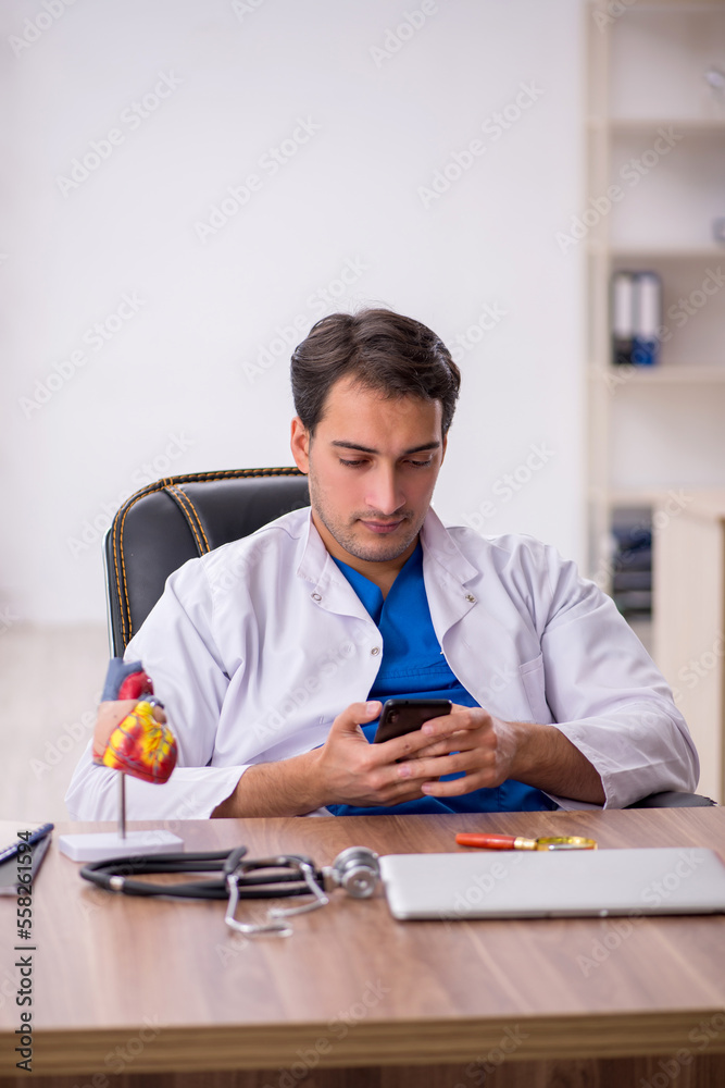 Young male doctor in telemedicine concept