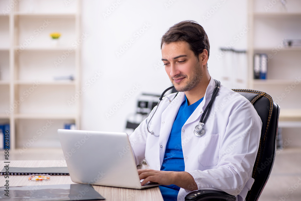Young male doctor in telemedicine concept Young male doctor in telemedicine concept