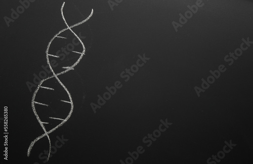 DNA Symbol drawn with chalk on blackboard. Science and biology concept
