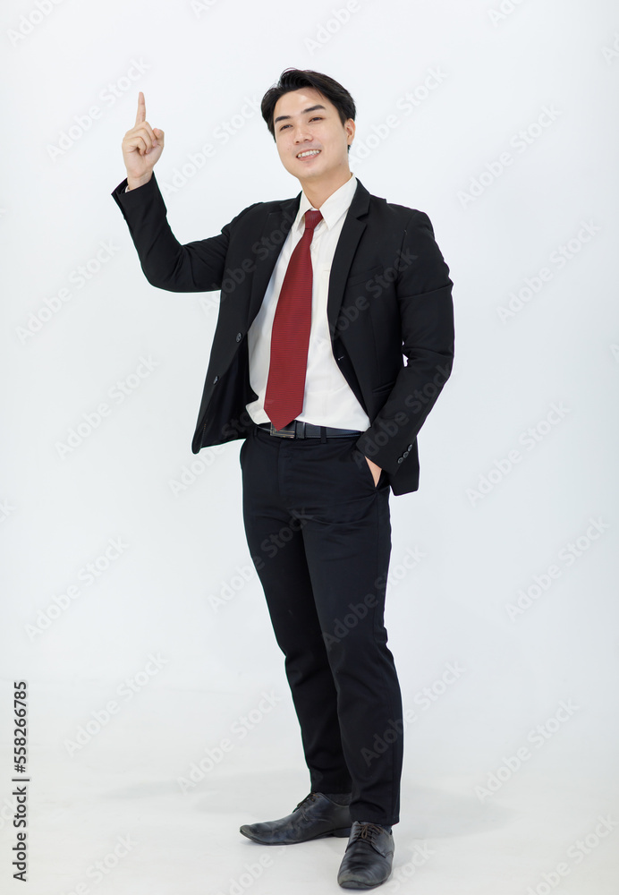 Portrait isolated cutout studio full body shot Millennial Asian professional successful male businessman manager in formal suit standing smiling holding hand up presenting product on white background Portrait isolated cutout studio full body shot Millennial Asian professional successful male businessman manager in formal suit standing smiling holding hand up presenting product on white background