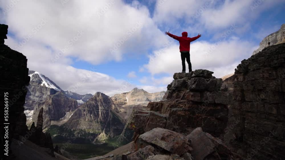 Victorious Man On Epic Mountain Peak Victorious Man On Epic Mountain Peak