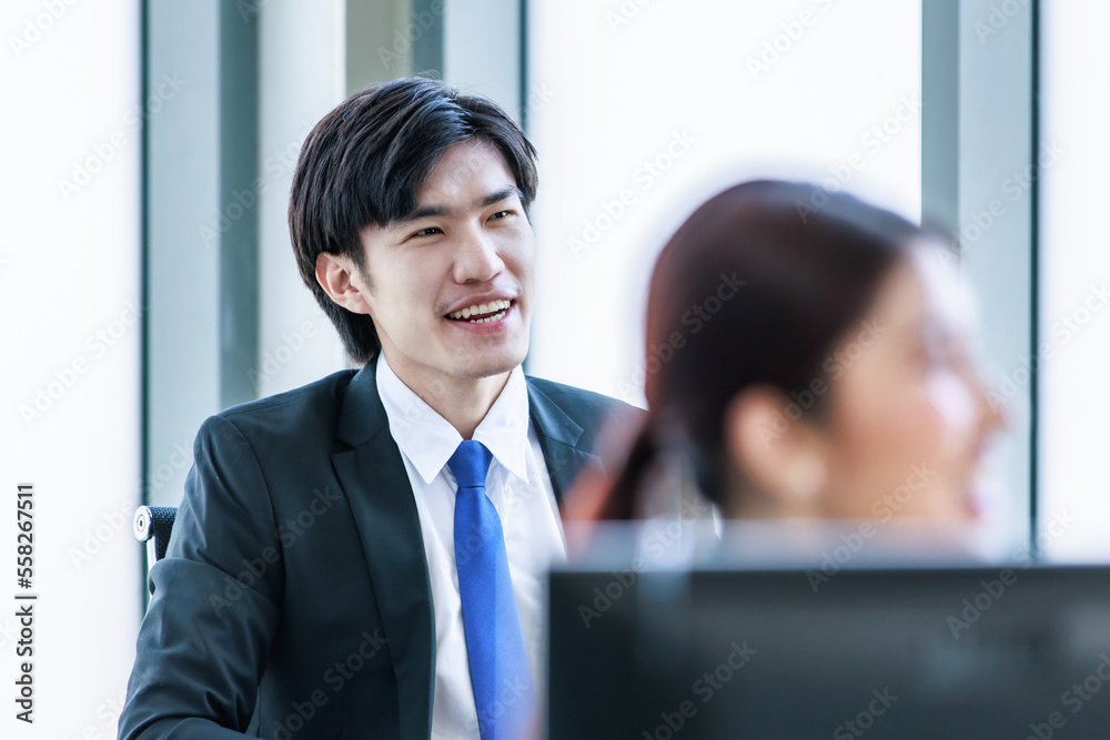 Closeup shot of Millennial Asian professional successful male businessman audience in formal suit sitting from lecturer in company office meeting room seminar workshop Closeup shot of Millennial Asian professional successful male businessman audience in formal suit sitting from lecturer in company office meeting room seminar workshop