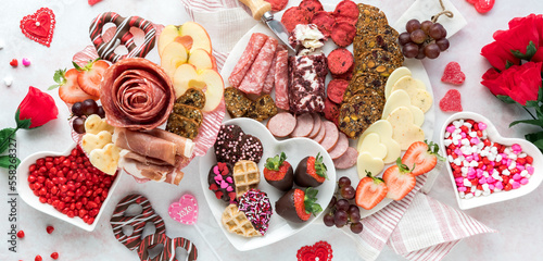 A Valentine's Day charcuterie arrangement with deli meats, cheese and sweets. © Carey