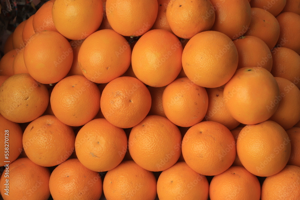 Closeup of fresh yellow orange in a market Closeup of fresh yellow orange in a market