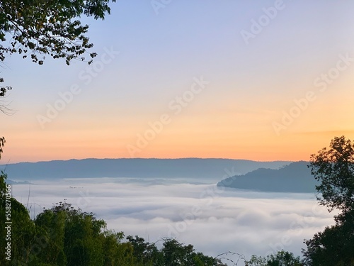 Beautiful sunrise on the Mekong River and mist at Phu Huay Isan, Nong Khai Province, Thailand photo