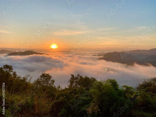 Beautiful sunrise on the Mekong River and mist at Phu Huay Isan, Nong Khai Province, Thailand