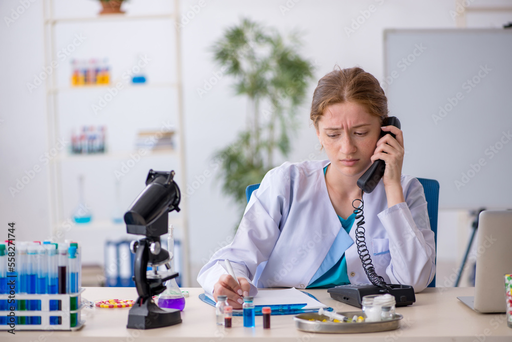 Young female chemist in drugs synthesis concept Young female chemist in drugs synthesis concept